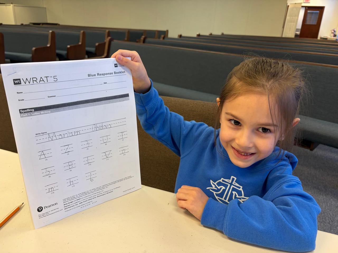 A COCA student celebrating academic achievement